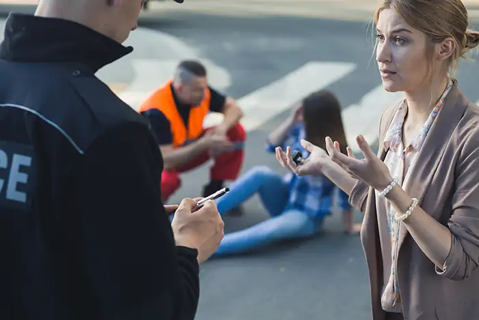 Witness giving statement after a car accident