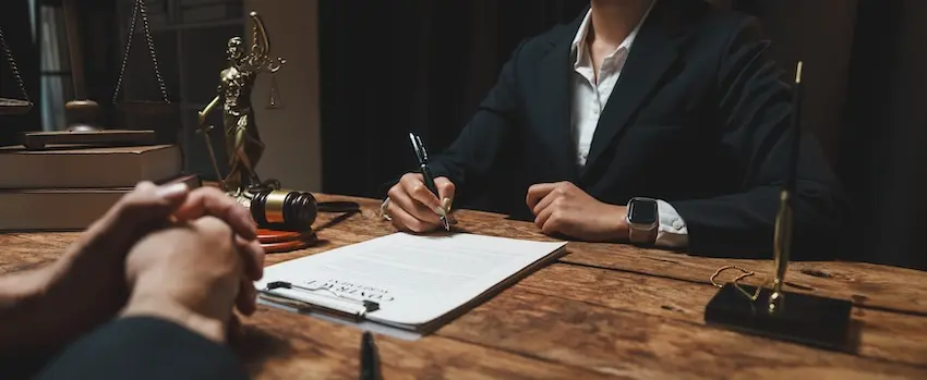 Damaged vehicle at car accident scene being inspected for insurance claim documentation