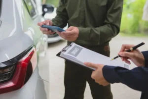 An experienced Tennessee car accident lawyer reviews documents with a client in an office