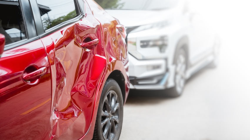 A Nashville car accident attorney in a suit shaking hands with a client