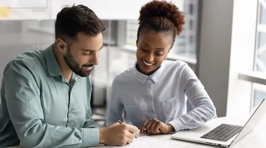 Auto accident liability case review with an attorney explaining legal rights to a collision victim during a consultation.