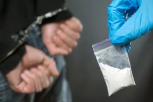 Illustration of law enforcement officers conducting an illegal search related to drug crimes in Nashville, focusing on the potential consequences of drug manufacturing and drug offenses.