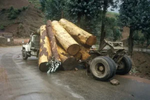 Log truck spill can cause accident due to the truck's cargo being in the roadway